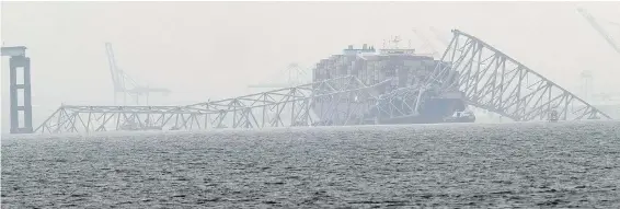  ?? MATT ROURKE, THE ASSOCIATED PRESS ?? A container ship rests against the wreckage of the Francis Scott Key Bridge in Baltimore, Maryland.