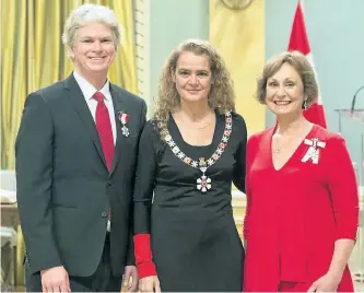  ?? SGT.JOHANIE MAHEU/ RIDEAU HALL ?? Westben Theatre's Brian Finley, left, and Donna June Bennett, right, of Campbellfo­rd, are invested as members of the Order of Canada by Governor General Julie Payette on Friday at Rideau Hall in Ottawa.