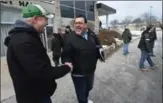  ?? MATHEW MCCARTHY, RECORD STAFF ?? Union local president Ray Burigana, carrying a binder, celebrates the end of the strike.