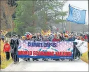  ?? REUTERS ?? Climate activists start a hike to the Alpine resort of Klosters in Landquart, Switzerlan­d, on Sunday.