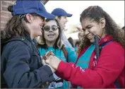  ?? PHOTOS BY JAY JANNER / AMERICAN-STATESMAN ?? Sophie Dunn (left), 17, and Natalie Avila, 18, both visually impaired and deaf, prepare for the march.