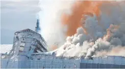  ?? | Reuters ?? SMOKE billows following a fire at the Old Stock Exchange, Boersen, in Copenhagen, Denmark, yesterday.