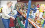  ?? FM4193912 ?? Rosemary Harding preparing a food bank basket