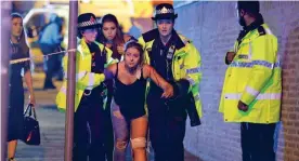  ??  ?? Blast horror: Injured victims at the Ariana Grande, inset, gig
