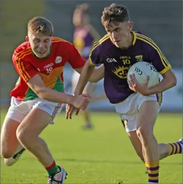  ??  ?? Wexford wing-forward Niall Connolly taking on David Dunphy of Carlow.