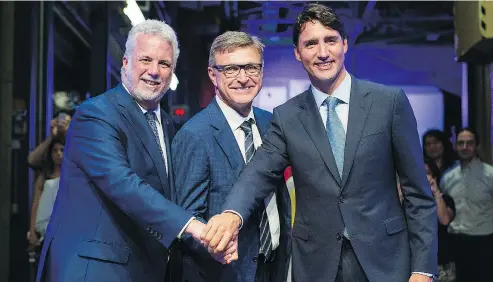  ?? GRAHAM HUGHES / THE CANADIAN PRESS ?? Prime Minister Justin Trudeau, right, Quebec Premier Philippe Couillard, left, and CAE president and CEO Marc Parent at the funding announceme­nt Wednesday at simulator-maker CAE in Montreal. The company is developing a new “innovation campus” in the...