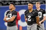  ?? HYOSUB SHIN/HSHIN@AJC.COM ?? Alabama quarterbac­k Tua Tagovailoa (left), with former starting QB Jalen Hurts on Friday at Mercedes-Benz Stadium, is the favorite to win the Heisman Trophy.