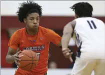  ?? Gregory Payan The Associated Press ?? Bishop Gorman’s Zaon Collins, left, played for club team Vegas Elite in the recent Big Time basketball tournament.