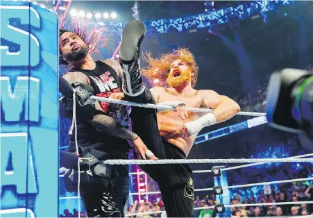  ?? WWE ?? Montreal’s Sami Zayn, right, delivers a Helluva Kick to Jimmy Uso during a 2023 episode of WWE SmackDown.