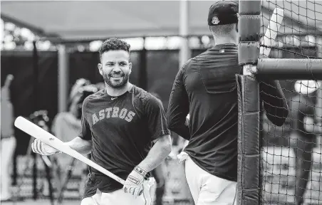  ?? Karen Warren / Staff photograph­er ?? Jose Altuve, left, switching places in the cage with Carlos Correa, was touched by the shortstop vouching for his character, saying, “Carlos is a great teammate to do what he did, go out there and defend his teammates. It’s amazing. It’s the only thing I have to say.”