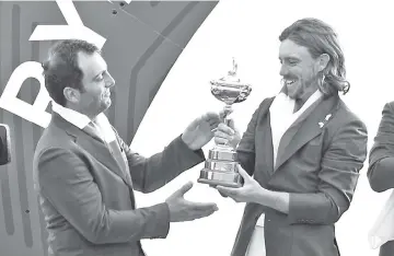  ??  ?? Tommy Fleetwood (right) and Francesco Molinari celebrate Europe’s 2018 Ryder Cup win. - AFP Photo