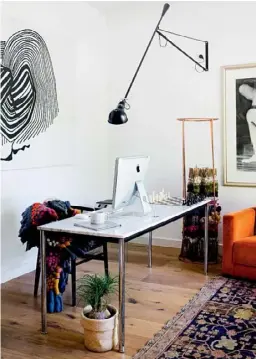  ??  ?? STUDY
The family’s home office (right) is filled with treasured possession­s, including an artwork by Charles Blackman (above an inherited armchair that has been re-covered in orange velvet) and a stunning monochroma­tic Dancing Lady artwork created by...