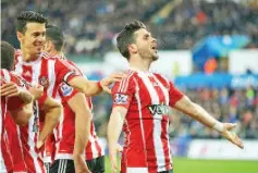  ??  ?? Southampto­n striker Shane Long celebrates opening the scoring against Swansea with a second-half header.