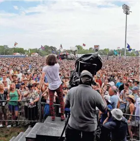 ?? GERALD HERBERT/AP ?? The view from the stage at the 50th anniversar­y of the New Orleans Jazz and Heritage Festival in 2019. Jazz Fest is back this year.