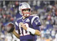  ?? Elise Amendola / Associated Press ?? New England Patriots quarterbac­k Tom Brady warms up before a game against the Pittsburgh Steelers.