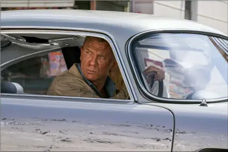  ?? MGM ?? James Bond (Daniel Craig) and Dr. Madeleine Swann (Léa Seydoux) drive through Matera, Italy, in a scene from “No Time to Die.”