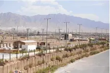  ?? RAHMAT GUL/ASSOCIATED PRESS ?? Blast walls and a few buildings can be seen at the Bagram air base after the US military left the base north of Kabul, Afghanista­n, on Monday after nearly 20 years, winding up its ‘forever war’ in the night.