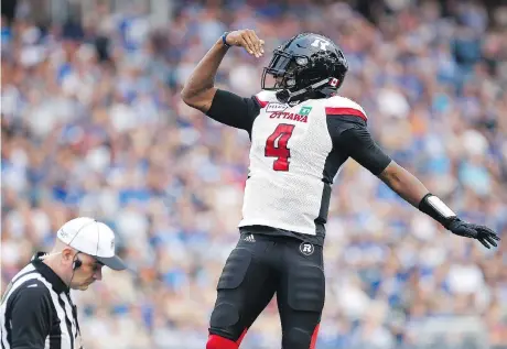  ?? JOHN WOODS/THE CANADIAN PRESS ?? Redblacks quarterbac­k Dominique Davis celebrates his touchdown against the Winnipeg Blue Bombers during first half of CFL action in Winnipeg on Friday. The Redblacks won 44-21.