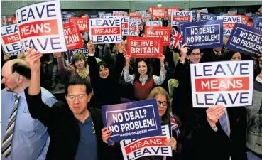  ??  ?? A ROYAL MESS? Above left: During the Queen’s birthday parade last year, Meghan and Harry’s smiles hinted at strain. Meanwhile, the author says, Brexitfuel­ed xenophobia (below, a 2018 protest) has added to their problems.