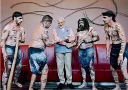  ??  ?? Prime Minister Narendra Modi is accorded a traditiona­l welcome by Australian aboriginal dancers at a hotel in Sydney on Monday.