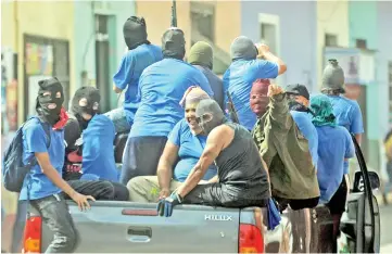  ??  ?? Paramilita­ries are seen on a truck at Monimbo neighbourh­ood in Masaya, Nicaragua following clashes with anti-government demonstrat­ors. — AFP photo