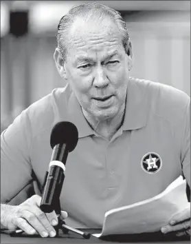  ?? MICHAEL REAVES/GETTY ?? Astros owner Jim Crane reads a prepared statement at a news conference on Thursday.