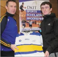  ??  ?? Daire Nally receives his All-Star jersey from Oisin McConville.