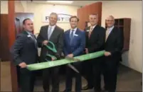  ?? SUBMITTED PHOTO ?? First Bank continues its expansion, recently opening a branch in West Chester. Attending last week’s ribbon-cutting ceremony are, from left: Ed Caporellie, First Bank West Chester branch manager; Mark Yoder, Greater West Chester Chamber of Commerce president; Patrick L. Ryan, First Bank president and CEO; Joseph Calabro, First Bank West Chester senior vice president, market executive; and Brent Cronnell, First Bank senior vice president, retail administra­tion.