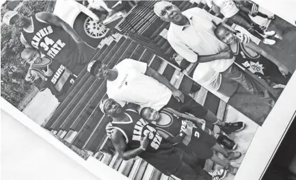  ??  ?? Antonio Braxton Sr. and Antonio Braxton Jr., are seen together in photos with current Memphis Tigers Basketball head coach Penny Hardaway in a photo album, July 03, 2019. BRAD VEST/THE COMMERCIAL APPEAL