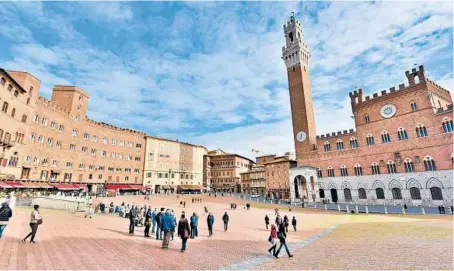  ?? CAMERON HEWITT/RICK STEVES’ EUROPE ?? Siena’s main square and gathering place is Il Campo. The great shell-shaped piazza features a sloped redbrick floor fanning out from the City Hall tower.