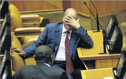  ?? PHOTO: ESA ALEXANDER ?? HARD JOB: President Jacob Zuma reacts to the protest in the house during the state of the nation address in Cape Town. There was no water for Zuma and the MPs due to Nehawu ’ s strike