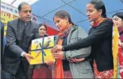  ?? DEEPAK SANSTA/HT ?? ■ HP CM Jai Ram Thakur distributi­ng the ‘Mahila Suraksha’ handbook to differentl­y abled students in Shimla.