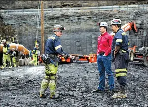  ?? AP/DAKE KANG ?? Corsa Chief Executive Officer George Dethlefsen, in red, talks to workers at a new Corsa coal mine in Friedens, Pa. The world’s biggest coal users — China, the United States and India — have increased coal mining this year.