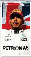  ?? GETTY IMAGES ?? Champion-elect: Hamilton on the podium