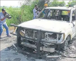  ?? PTI ?? A car burnt by some unidentifi­ed people at Kotli village in Sirsa on Monday.