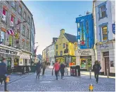  ?? STEPHEN DUFFY/FÁILTE IRELAND ?? Shop Street in Galway boasts bright shops and plenty of pubs.