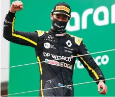  ?? Photo — AFP file ?? Ricciardo celebrates on the podium after the German Formula One Eifel Grand Prix at the Nuerburgri­ng circuit in Nuerburg, western Germany.