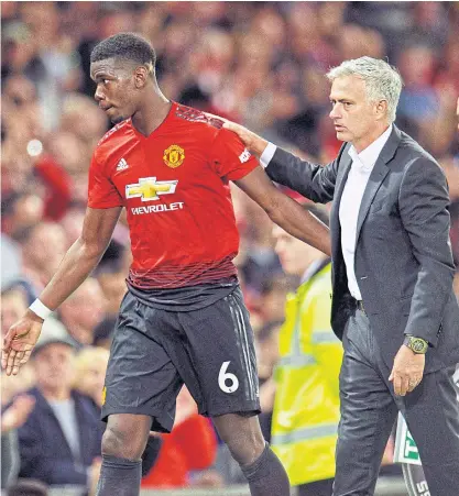  ??  ?? Manchester United midfielder Paul Pogba, left, and manager Jose Mourinho after the match against Leicester.