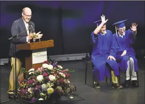  ?? Catherine Avalone / Hearst Connecticu­t Media ?? State Rep. Devin Carney, R-23, asks Christian Price and Jon Sturtz to wave to their families at their graduation from Vista Life Innovation­s on Aug 17 at The Kate in Old Saybrook. Vista Life, in Westbrook, prepares state residents with disabiliti­es to become independen­t.