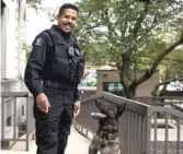  ?? ASHLEE REZIN/SUN-TIMES ?? Cook County Sheriff’s Officer David Parker and K-9 partner Joey check for bombs outside the Leighton Criminal Courthouse on Oct. 2.