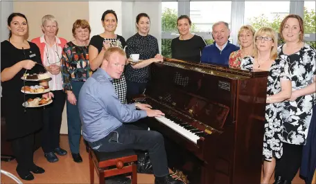  ??  ?? Mari O’Connell, Director of Nursing Kerry Specialist Palliative of Care, ( fifth from left of photo ) was delighted to accept the wonderful gift of a Piano from the Hayfield family Collection Royal Hotel Killarney/Scally family Killarney. At the Palliative Care at University Hospital Kerry on Monday during the Hospice Coffee Morning at the Palliative Care, from left Kamile Lyne, Aleen Clifford, Noreen Crean, Claire Scally, Hayfield Family Collection Royal Hotel Killarney,Mari O’Connell, Direction of Nursing Palliative Care, Eimear Hallissey, Joe Hennebery chairman Kerry Hospice Foundation Tralee branch, Aine Moriarty CNN2, Carmel O’Connor, and Aileen Diggins CNN1 and Cormac Dineen pianist. Photo: John Cleary.