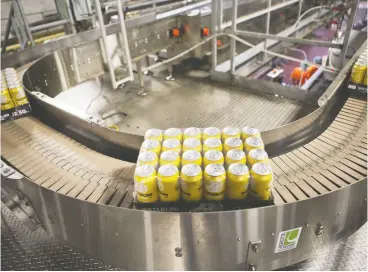  ?? DELLA ROLINS / BLOOMBERG ?? Waterloo Brewing Ltd. is aiming to more than double the volume of beverages it’s producing for other popular brands such as Absolut Vodka and Mott’s Clamato.