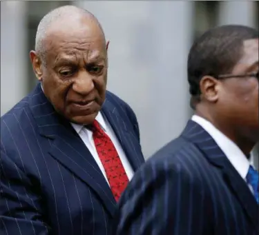  ?? ASSOCIATED PRESS ?? Bill Cosby and his personal assistant leave the courtroom after a pretrial hearing for his sexual assault case at the Montgomery County Courthouse in Norristown on Friday.