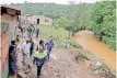  ?? ?? THE MEC for Co-operative Governance and Traditiona­l Affairs, Sihle Zikalala joined leadership of the umgungundl­ovu District and umsunduzi Local Municipali­ty in leading mopping-up operations yesterday after heavy rain destroyed property in the area.