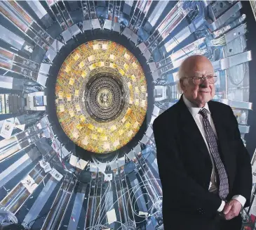  ?? GETTY IMAGES ?? Nobel Prize-winning physicist Professor Peter Higgs in front of a photograph of the Large Hadron Collider in London in 2013.