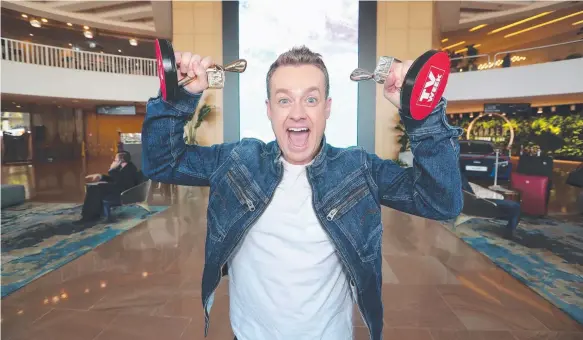  ?? Picture: RICHARD GOSLING ?? Sunday night’s big winner Grant Denyer with his two Logies in the foyer of The Star yesterday.