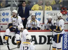  ??  ?? Nashville Predators coach Peter Laviolette and players pause at the bench during the third period in Game 5 of the team's NHL hockey Stanley Cup Final against the Pittsburgh Penguins on Thursday in Pittsburgh. AP PHOTO