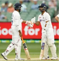  ??  ?? INDIA VS AUSTRALIA: India’s Ajinkya Rahane and Ravindra Jadeja during the second test match of the series between India and Australia at Melbourne Cricket Ground in Melbourne on Sunday