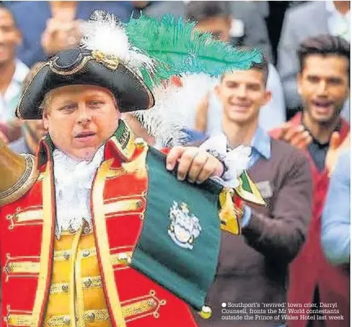  ??  ?? Southport’s ‘revived’ town crier, Darryl Counsell, fronts the Mr World contestant­s outside the Prince of Wales Hotel last week