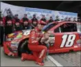  ?? DARRON CUMMINGS — THE ASSOCIATED PRESS ?? Kyle Busch poses with his son, Brexton, after winning the pole for the Brickyard 400 at Indianapol­is Motor Speedway.